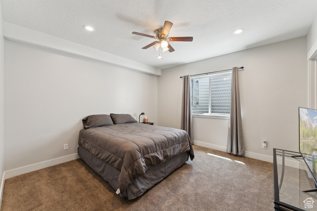 Carpeted bedroom with recessed lighting, baseboards, and a ceiling fan