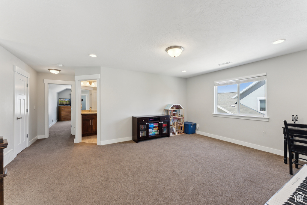 Playroom featuring carpet floors, baseboards, and recessed lighting