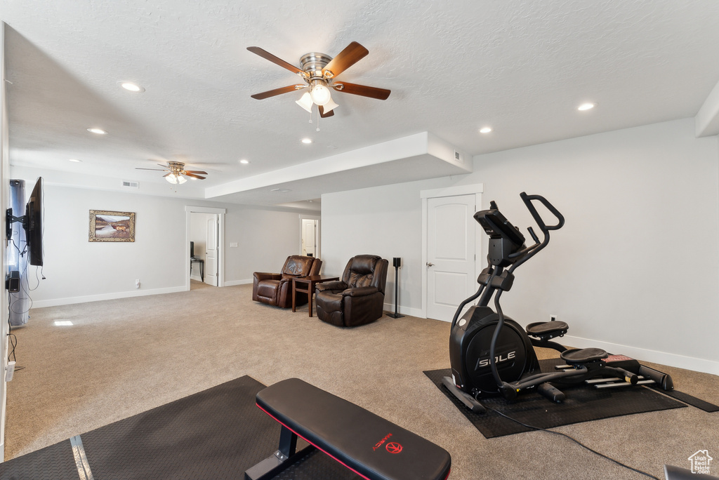 Workout area featuring a ceiling fan, recessed lighting, baseboards, carpet, and a textured ceiling