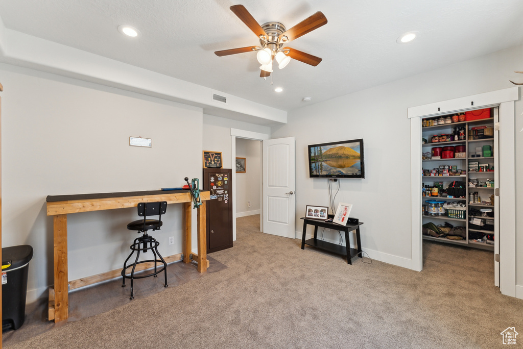 Carpeted office featuring a ceiling fan, recessed lighting, and baseboards