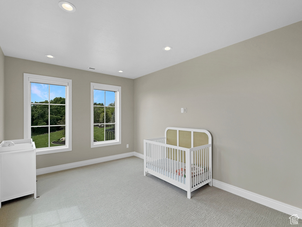 Unfurnished bedroom featuring carpet flooring, baseboards, and recessed lighting