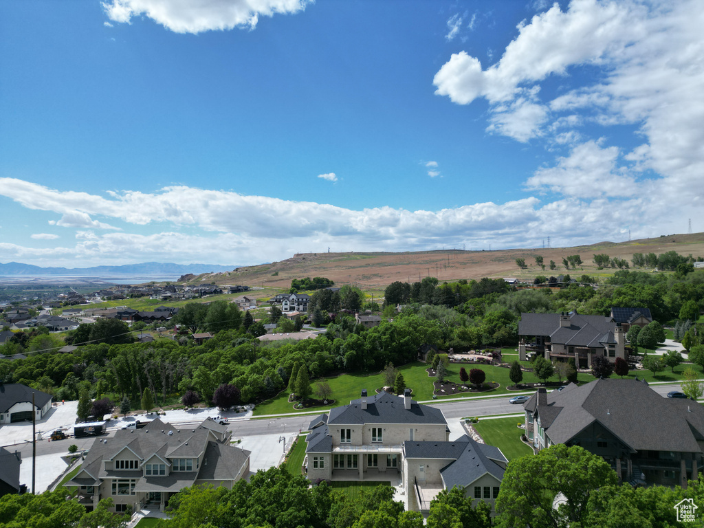 Aerial view of residential area featuring a mountain backdrop