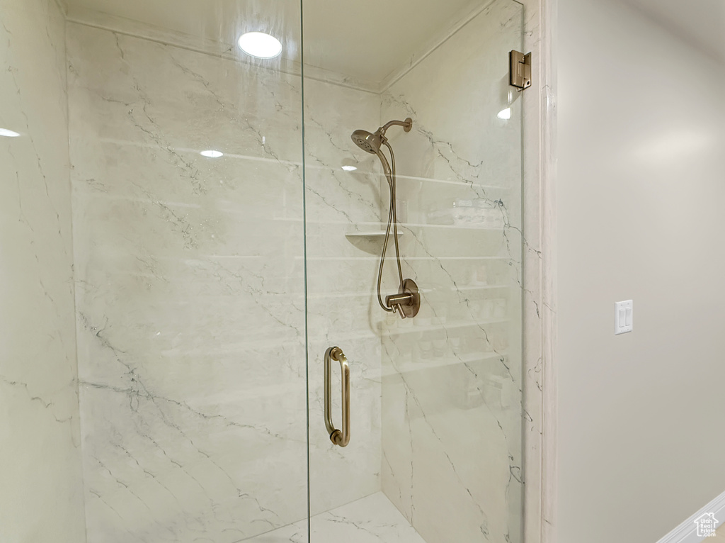 Bathroom with a marble finish shower