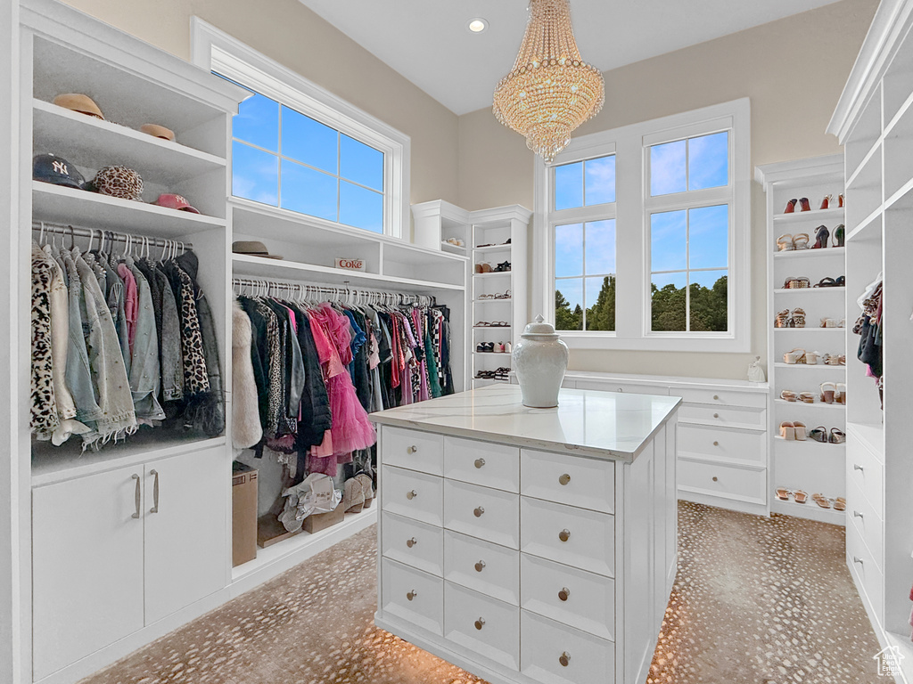 Spacious closet with a chandelier