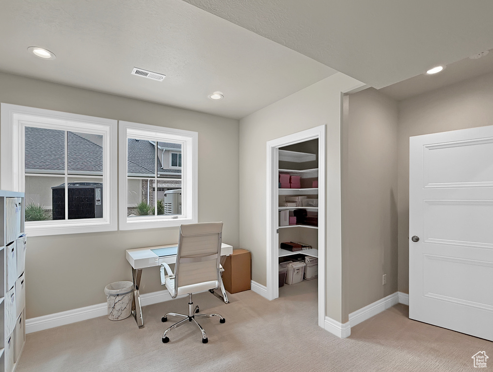 Home office with light carpet, recessed lighting, and baseboards