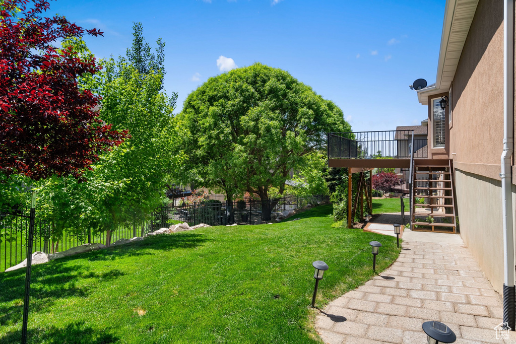 View of yard featuring stairway
