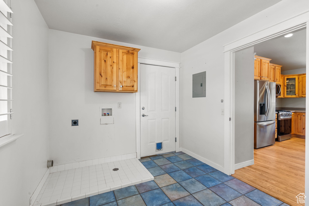 Laundry room featuring electric panel, hookup for an electric dryer, washer hookup, and baseboards