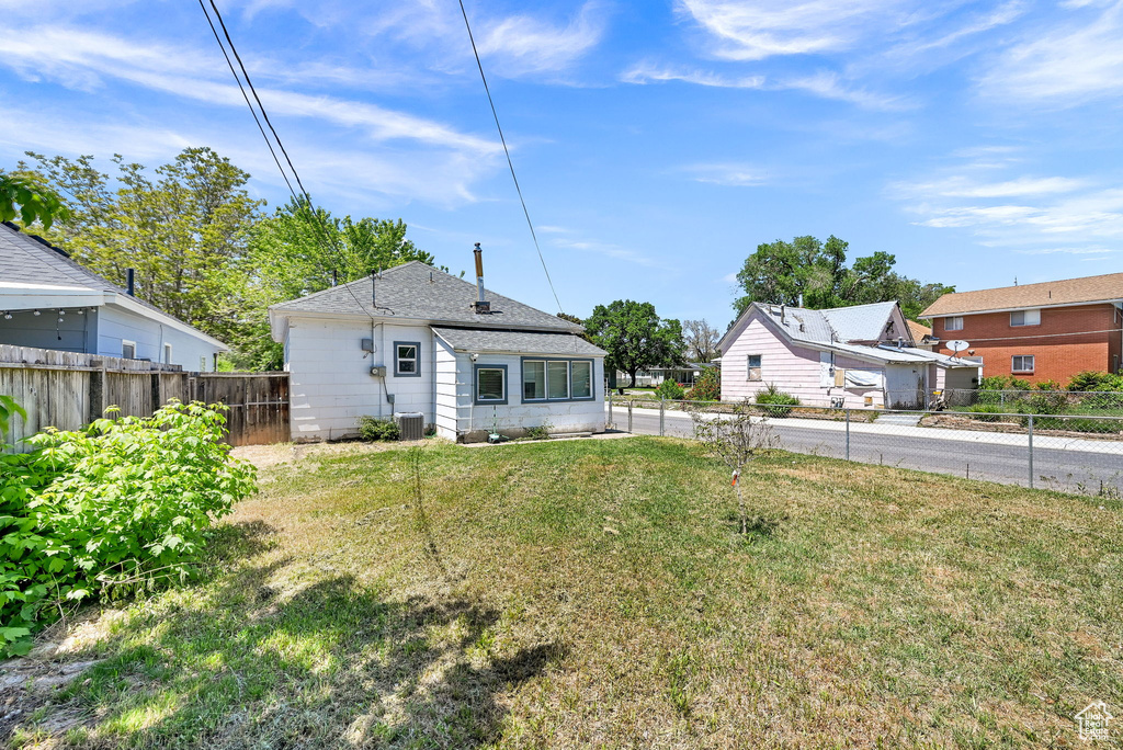 Back of property featuring central air condition unit