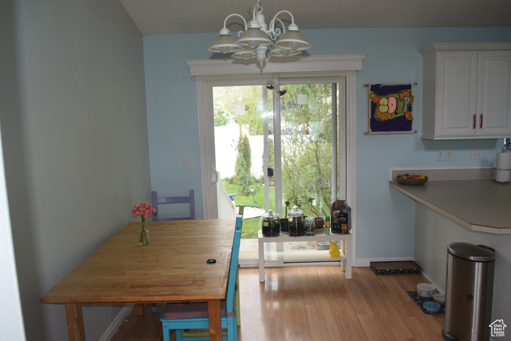 Dining room featuring a chandelier and wood finished floors