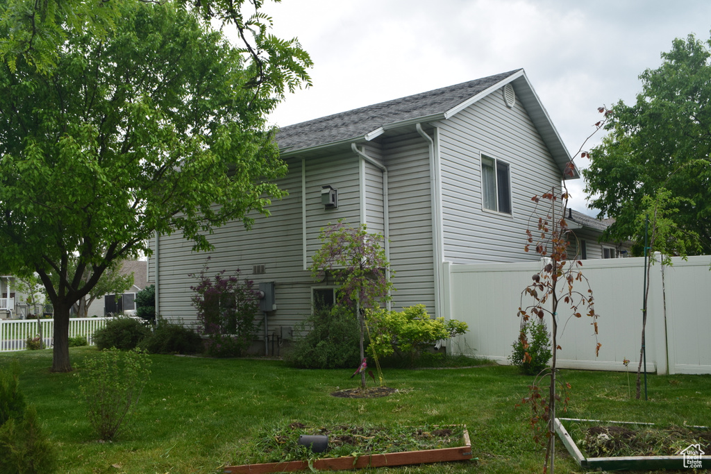 View of property exterior with a vegetable garden