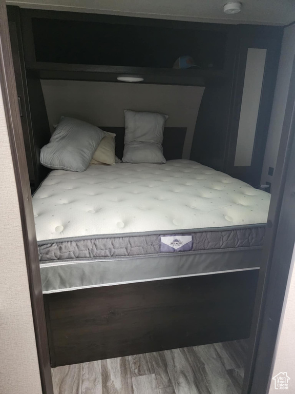 Bedroom with wood finished floors