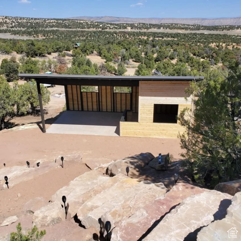 Rear view of house featuring a mountain view