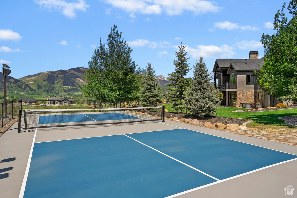 View of tennis court featuring a mountain view