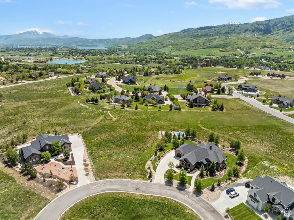 Aerial overview of property\\\'s location with a water and mountain view and nearby suburban area
