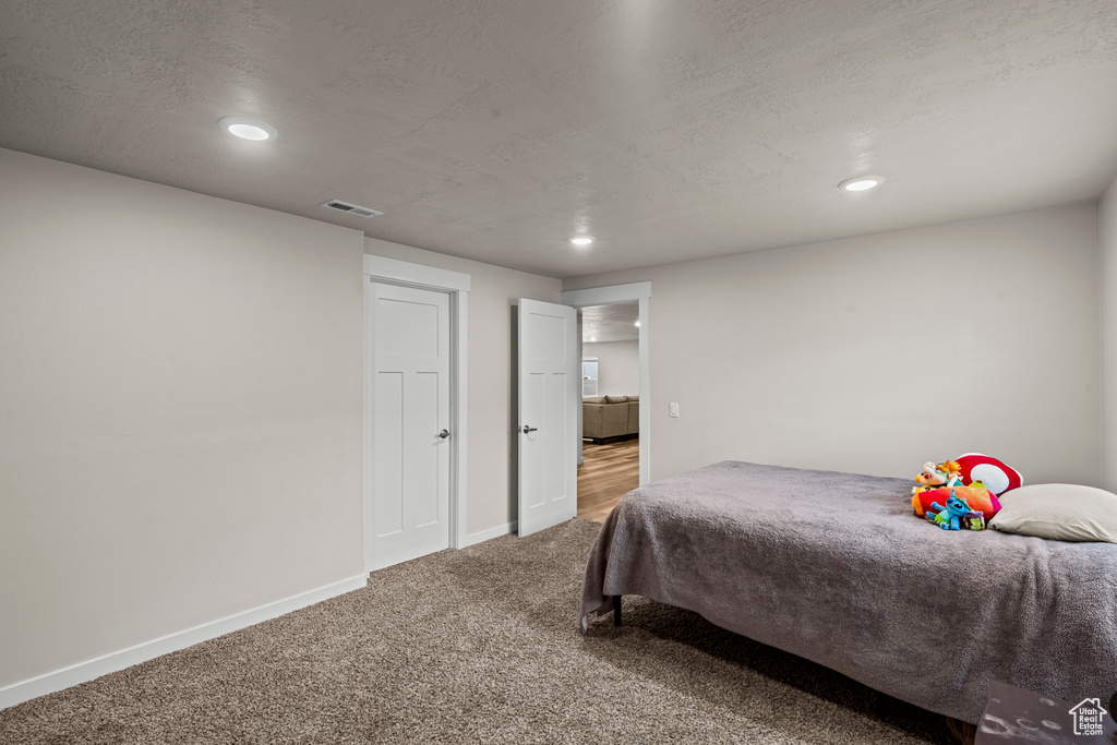 Bedroom with carpet flooring, recessed lighting, and baseboards