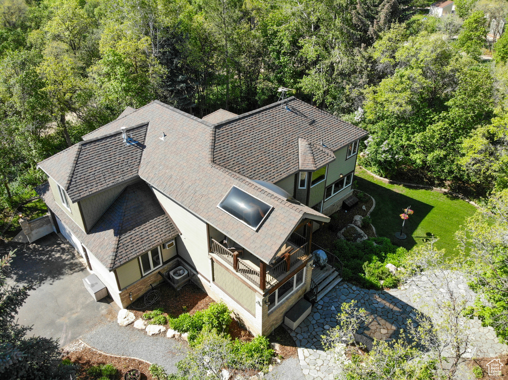 View from above of property with a forest