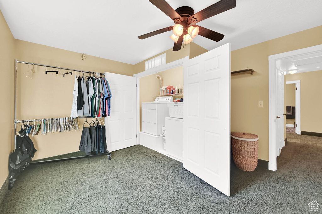 Bedroom featuring washing machine and dryer, carpet flooring, and ceiling fan