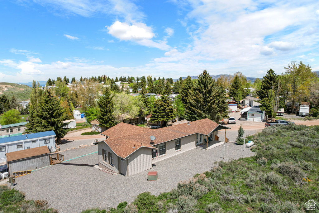 View from above of property with a mountain backdrop