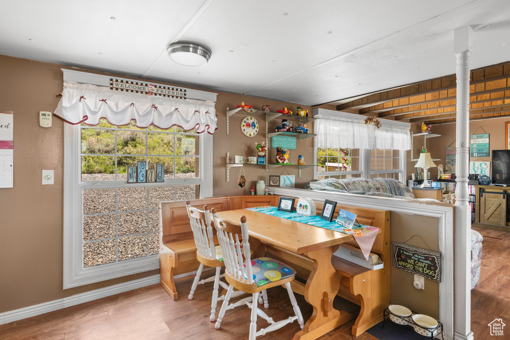 Dining room featuring wood finished floors and baseboards