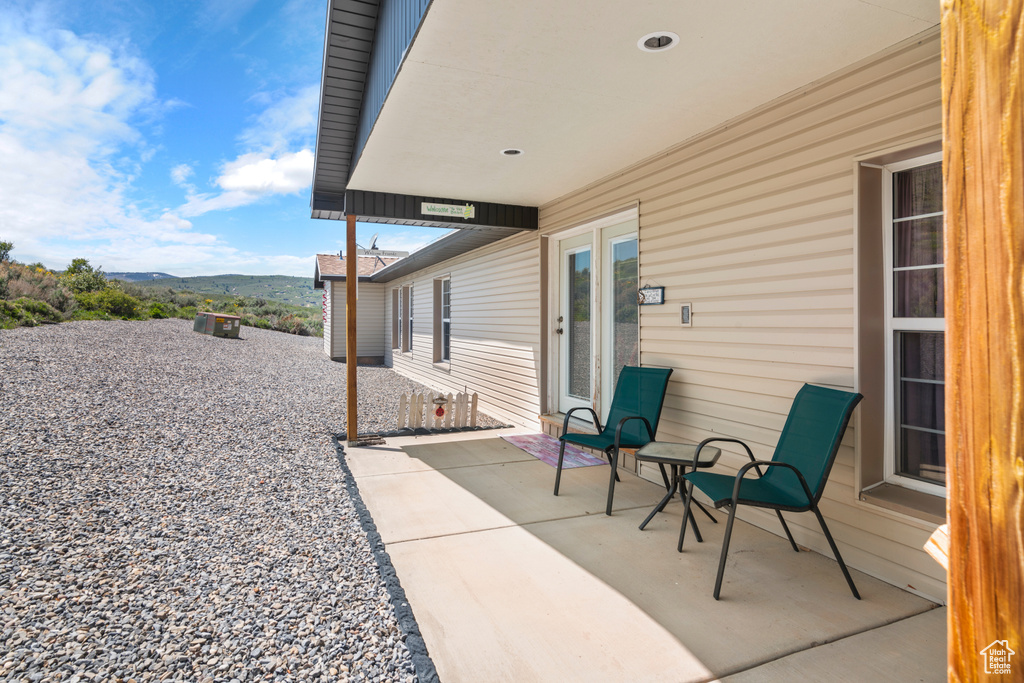 View of patio / terrace with a mountain view