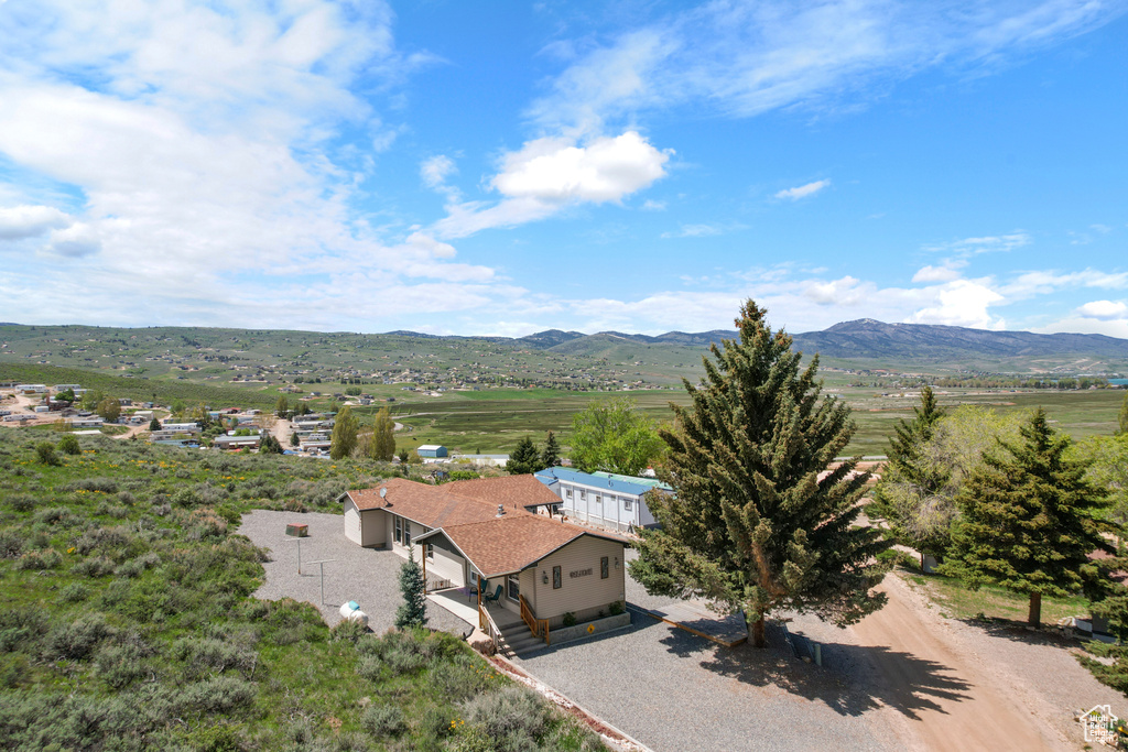View of mountain backdrop featuring rural landscape