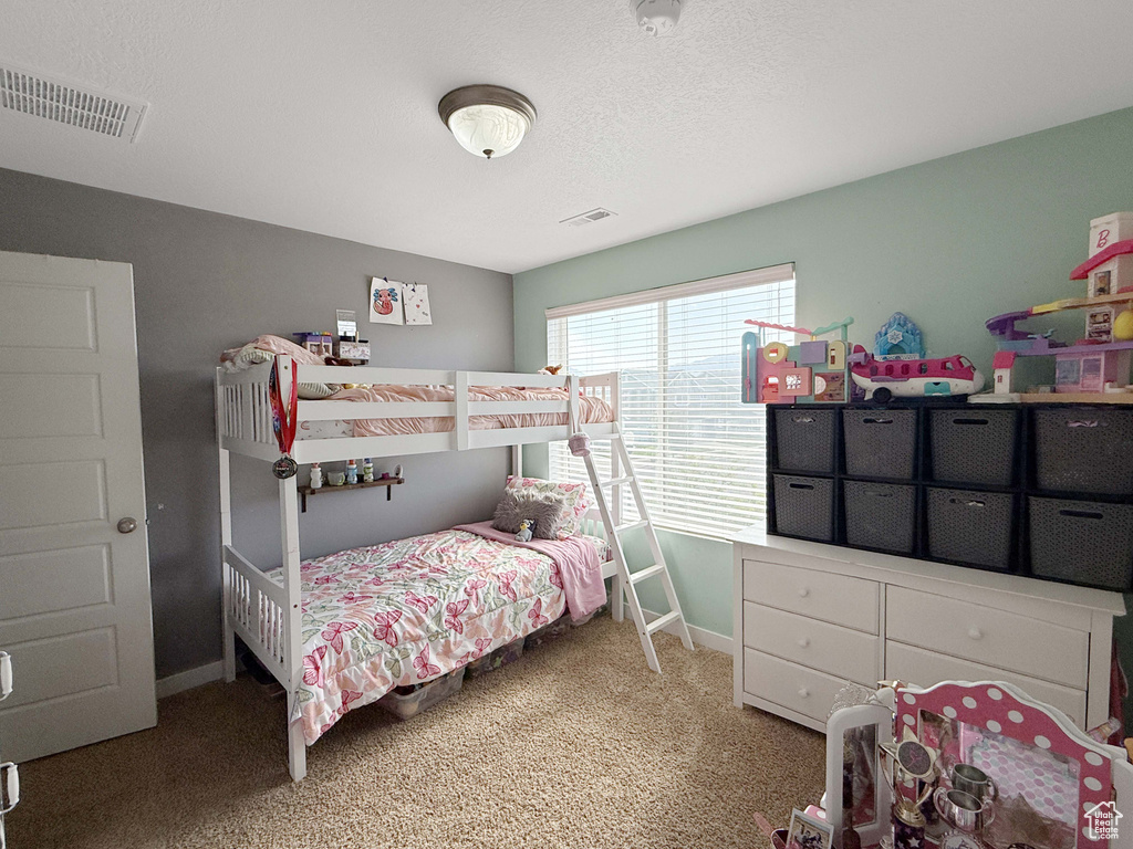 Bedroom with carpet floors and baseboards