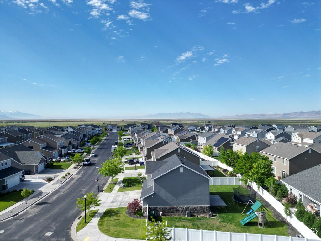 Aerial view of residential area featuring mountains