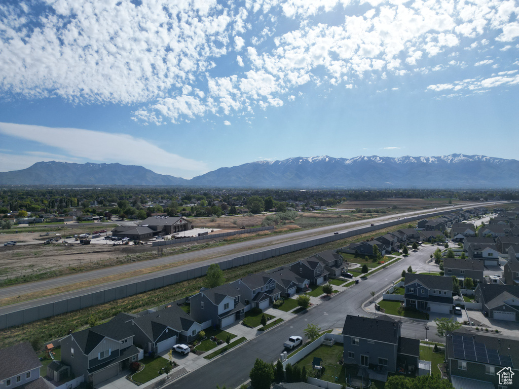 Aerial perspective of suburban area with a mountainous background