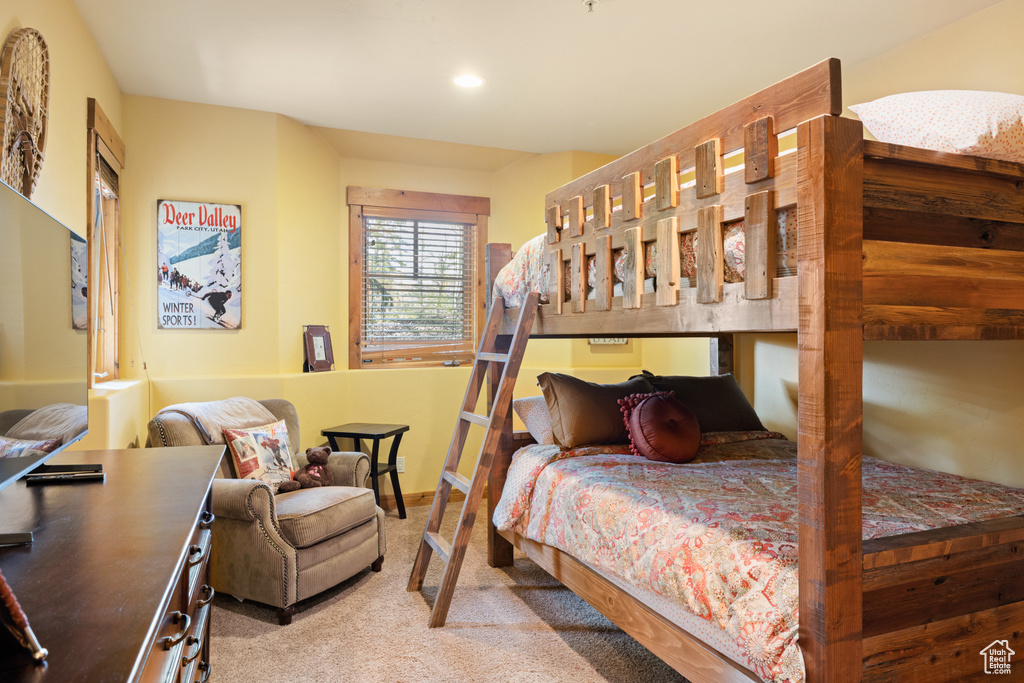 Carpeted bedroom with recessed lighting