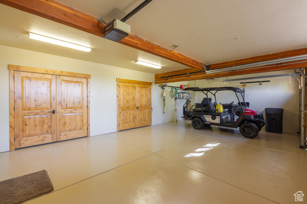 Garage featuring a garage door opener