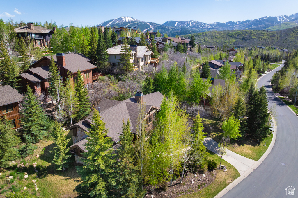 Aerial perspective of suburban area with a mountainous background