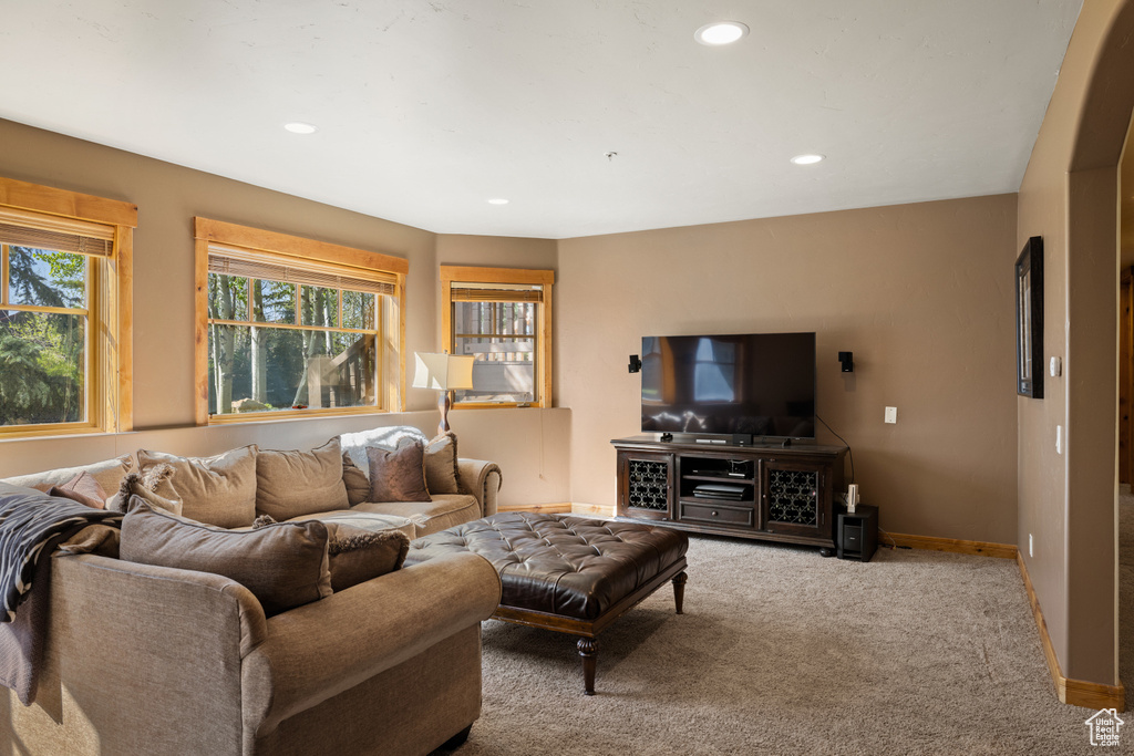 Living room with recessed lighting, carpet, and baseboards