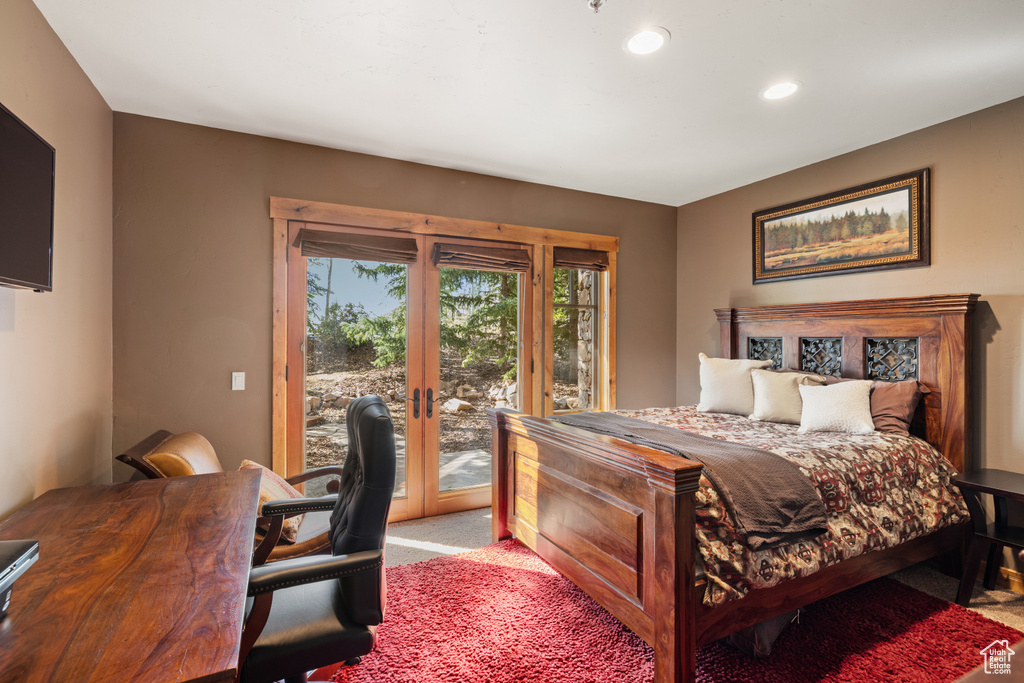 Bedroom featuring access to outside, carpet floors, and recessed lighting