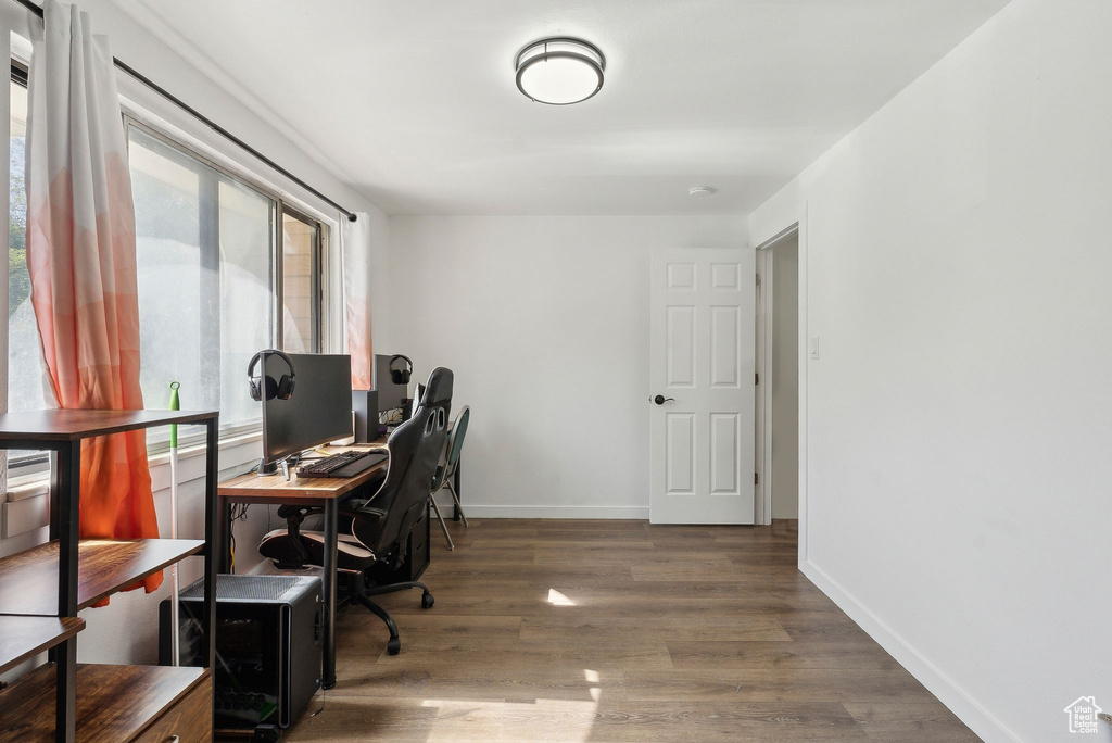 Office area with wood finished floors and baseboards