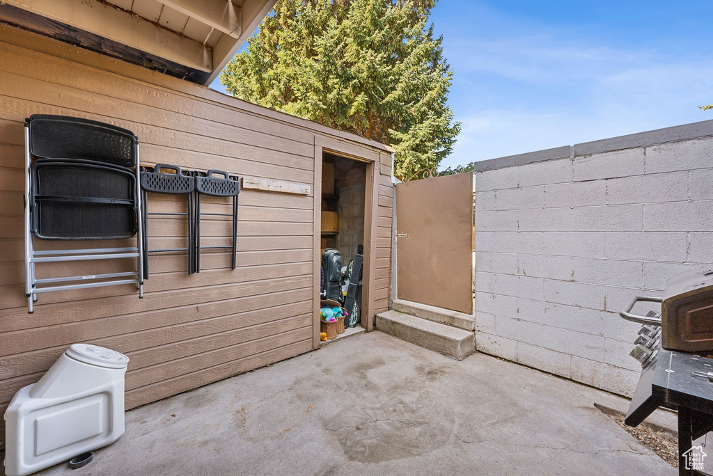 View of patio with fence