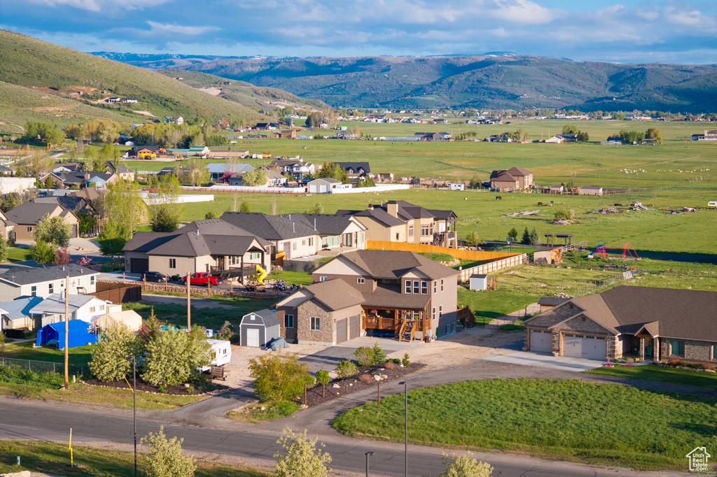 Aerial perspective of suburban area featuring a mountain backdrop