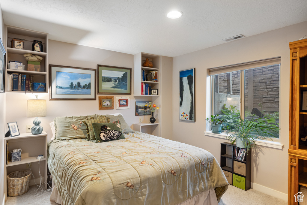 Bedroom featuring carpet, baseboards, and recessed lighting