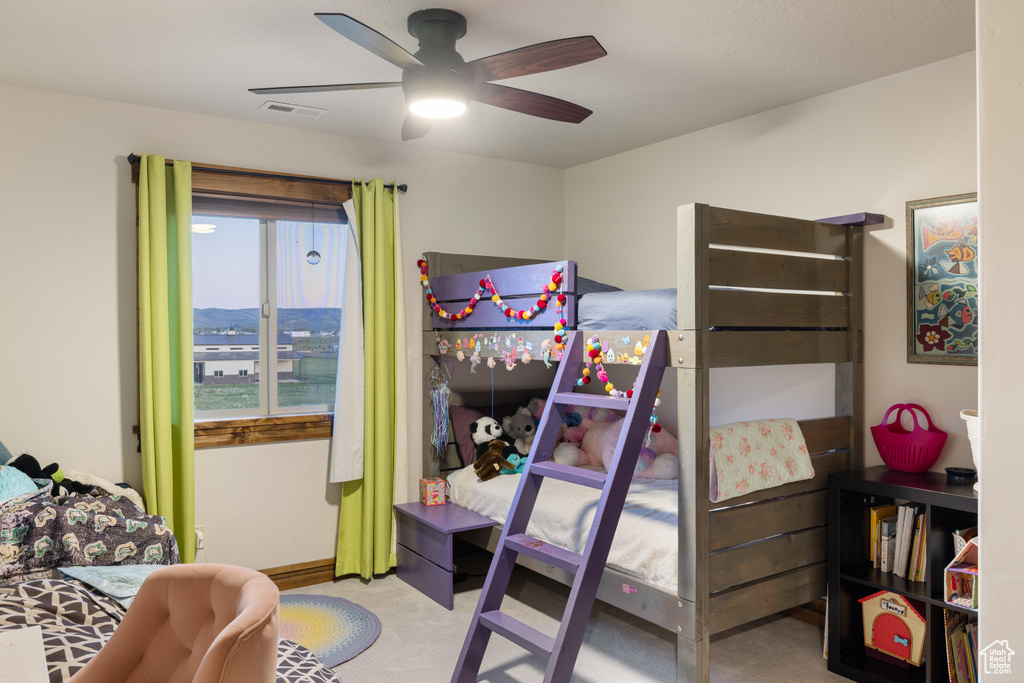 Bedroom featuring carpet flooring and ceiling fan