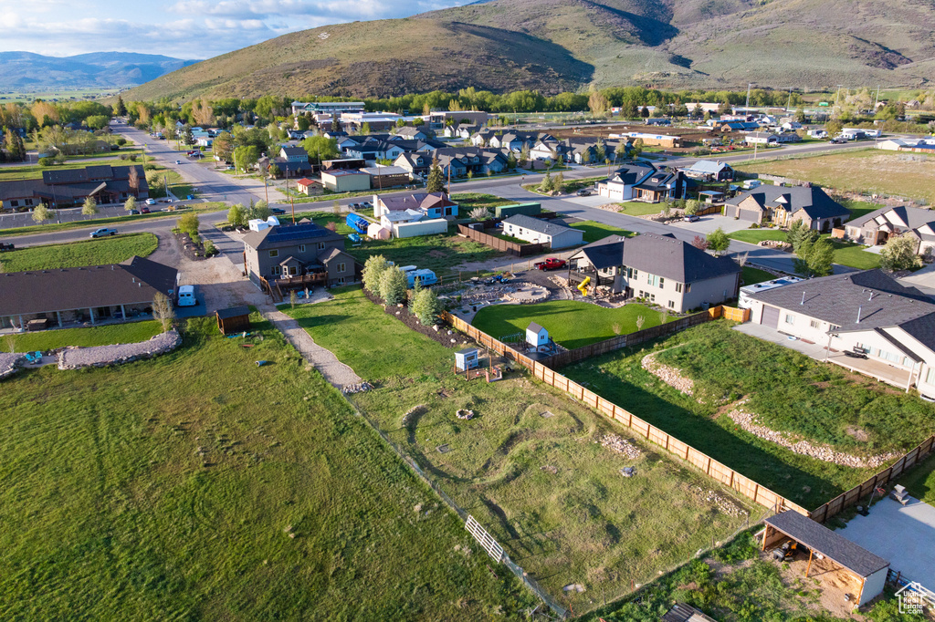 View of property location with mountains and nearby suburban area
