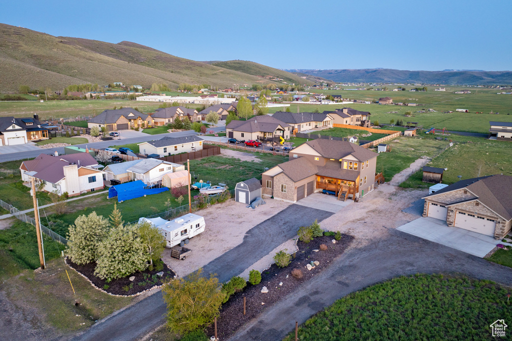 Aerial perspective of suburban area with a mountainous background