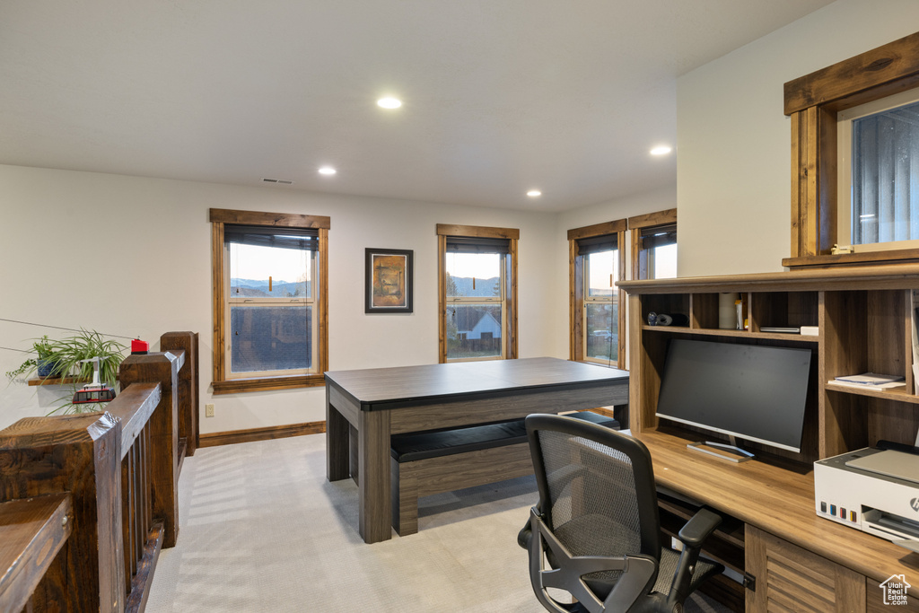 Office space with recessed lighting, light colored carpet, and baseboards