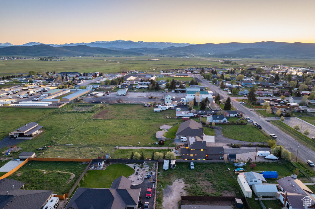 Aerial overview of property\'s location featuring a mountainous background