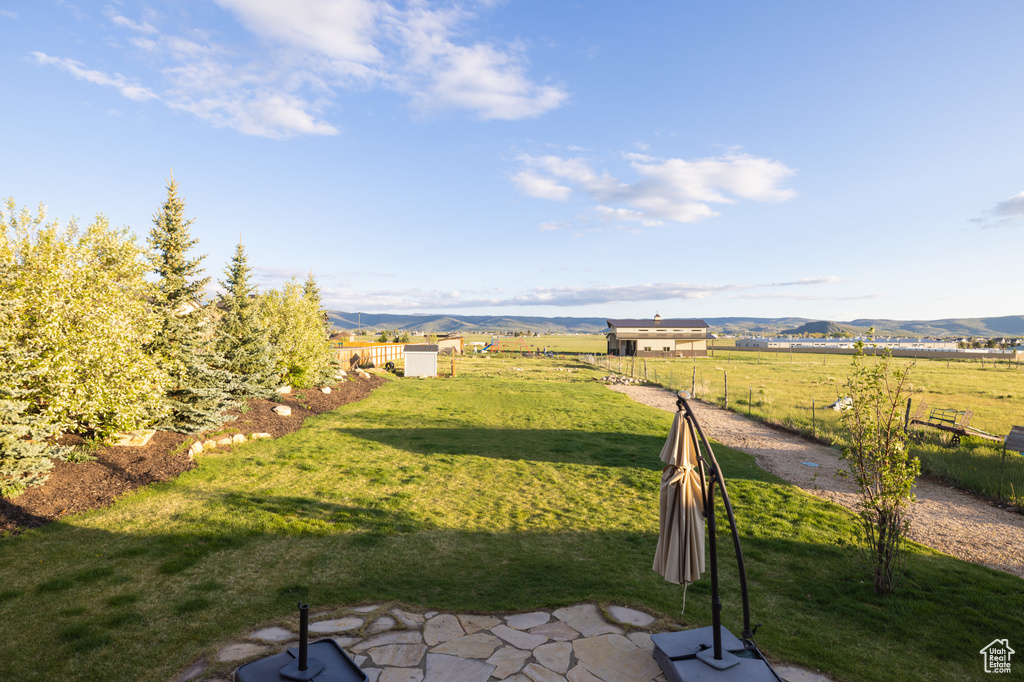 View of yard with a view of countryside and a mountain view