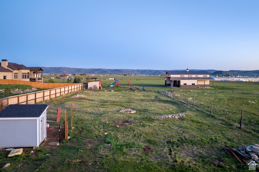 View of yard featuring a view of countryside and a mountain view