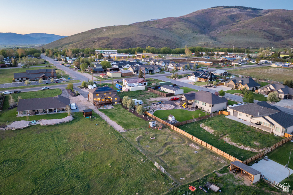 Aerial view at dusk of a residential view and a mountain view