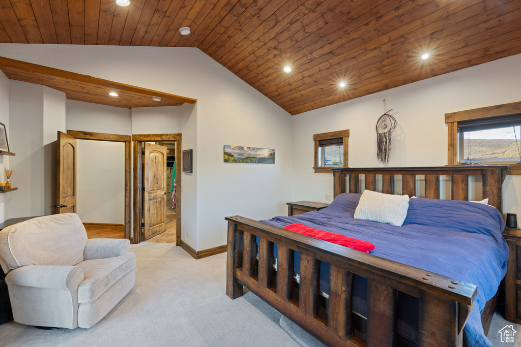 Bedroom featuring lofted ceiling, light colored carpet, recessed lighting, wood ceiling, and baseboards