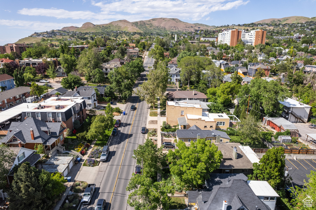 Aerial overview of property\'s location with a mountain backdrop and nearby suburban area