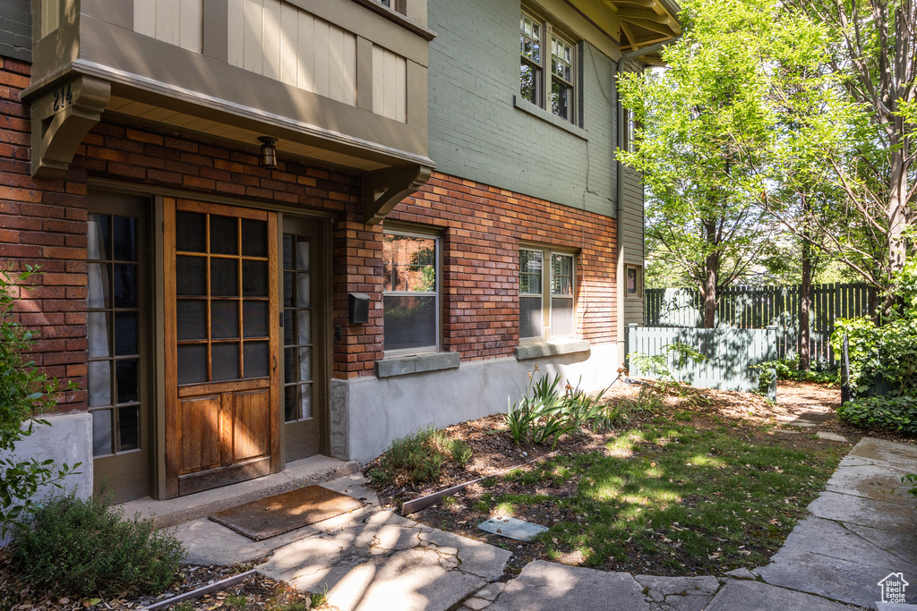 Entrance to property with brick siding