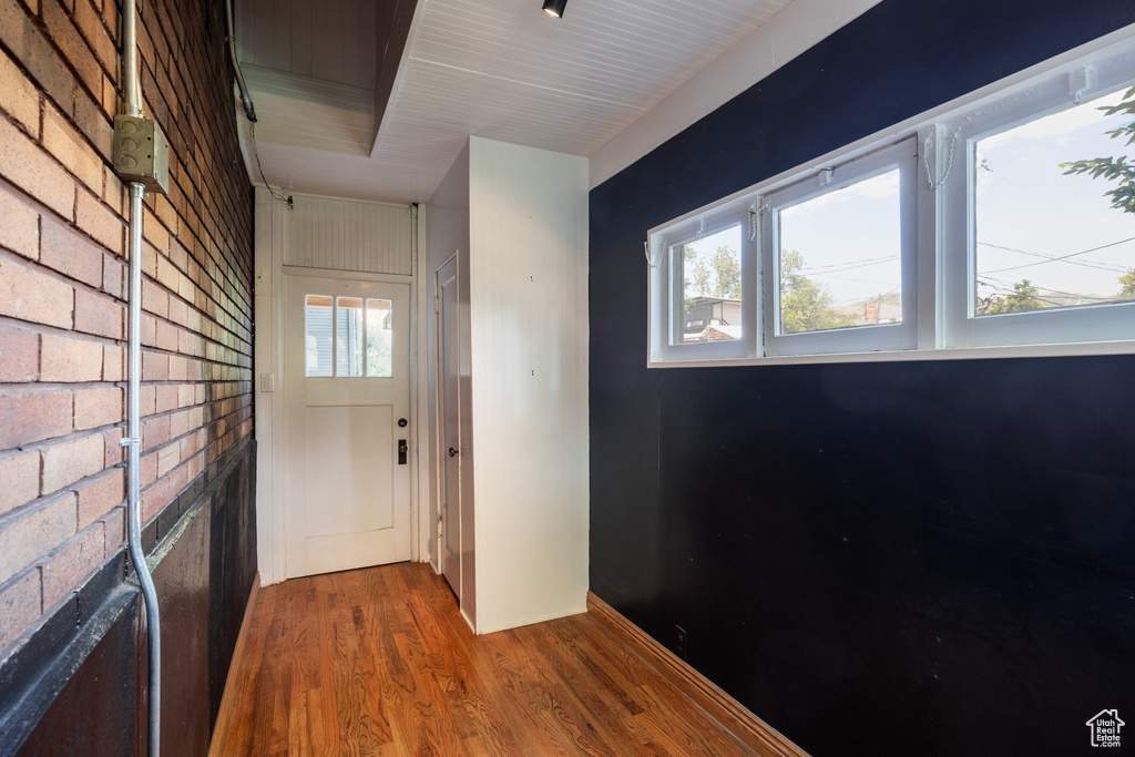 Doorway featuring wood finished floors