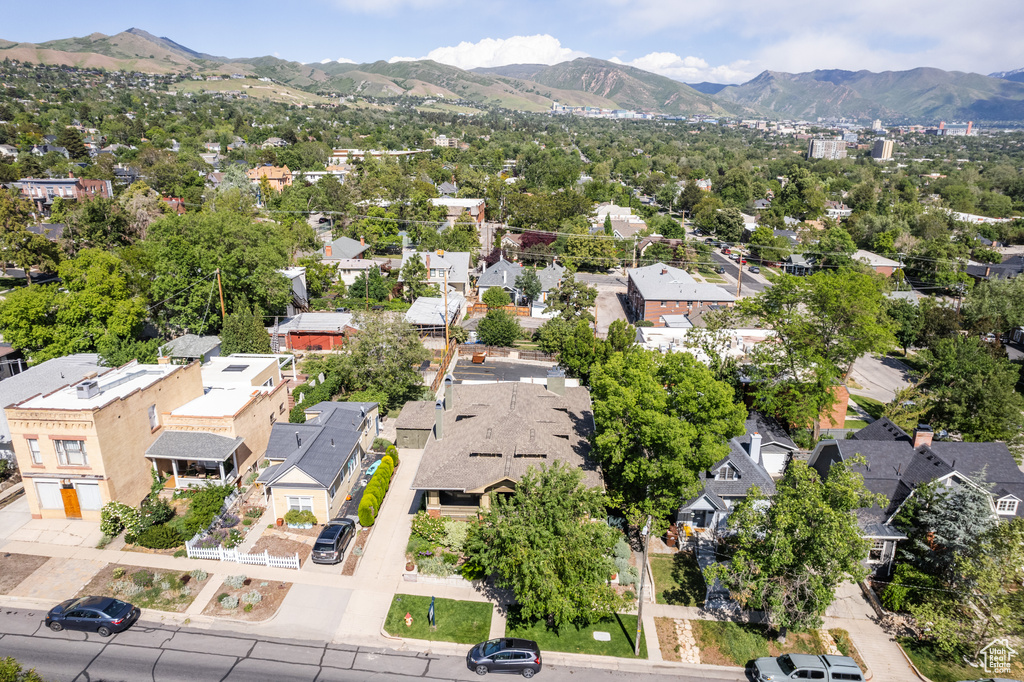 Aerial view of residential area featuring a mountainous background